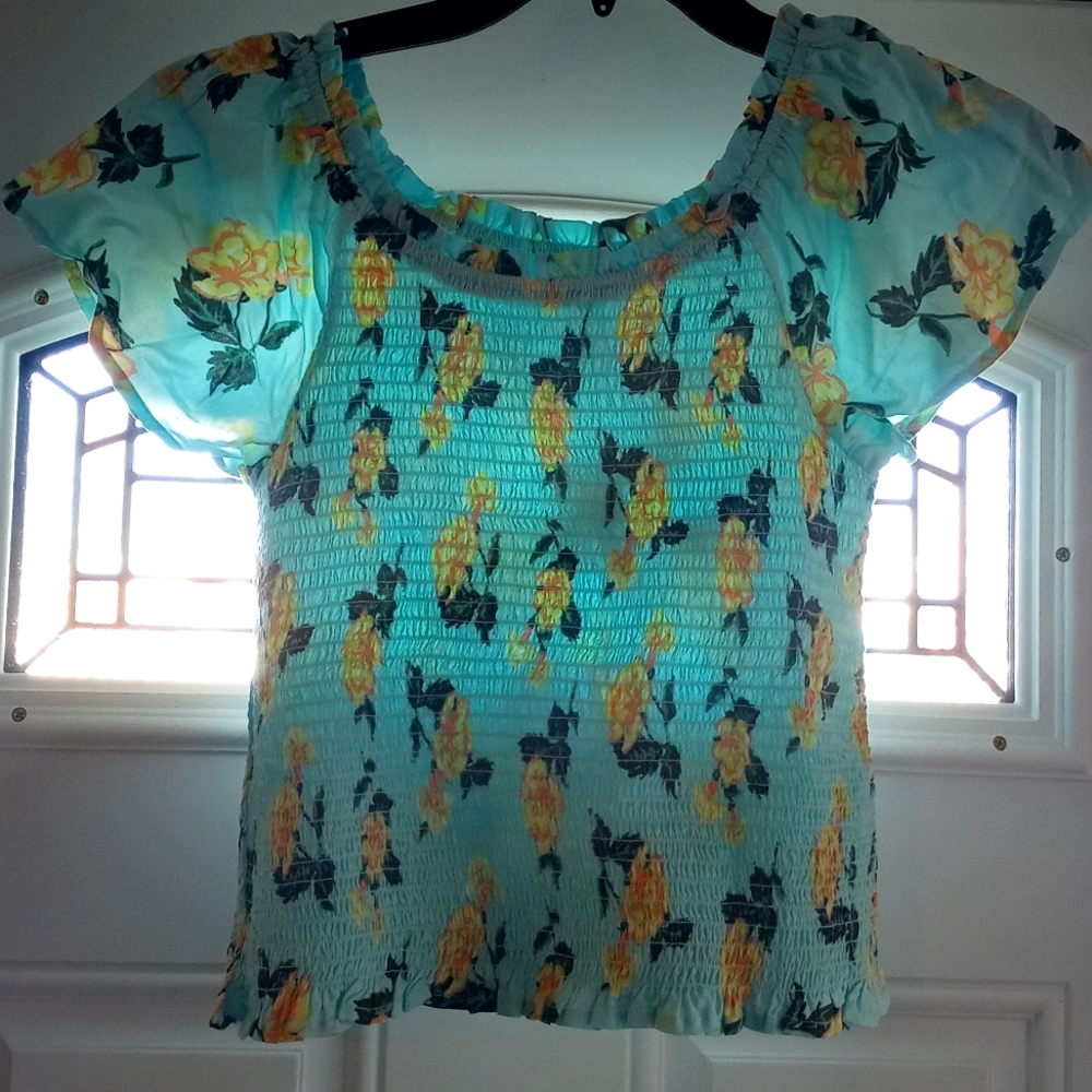 NWT Justice girls blue short sleeve shirt with beautiful yellow flowers.